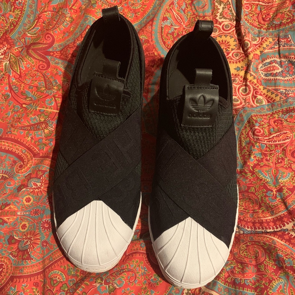 Brand new. Never worn. Awesome slip on adidas.